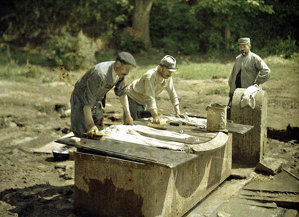 Three French Soldiers Doing Laundry at a Well, Soissons, Aisne, France, 1917 by Fernand Cuville