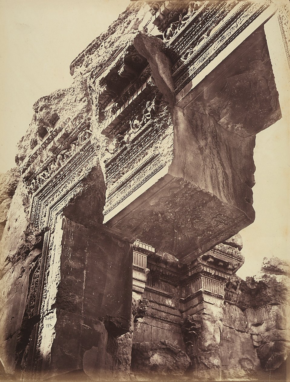 Detail of the entrance to a temple, in the archeological zone of Heliopolis or Baalbek, ancient Syrian city, now Lebanon by Félix Bonfils