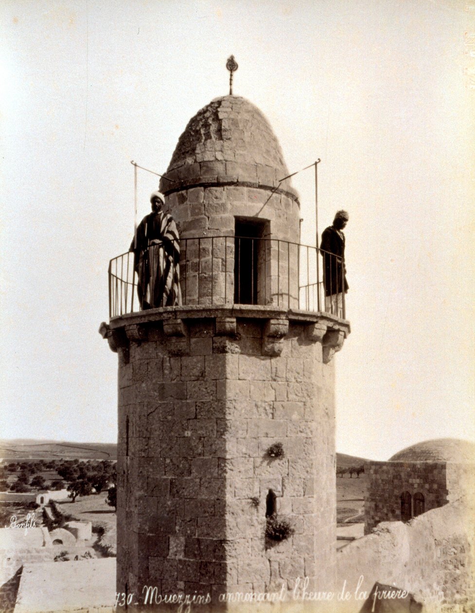 Two muezzin calling the faithful to prayer from the top of a minaret by Félix Bonfils