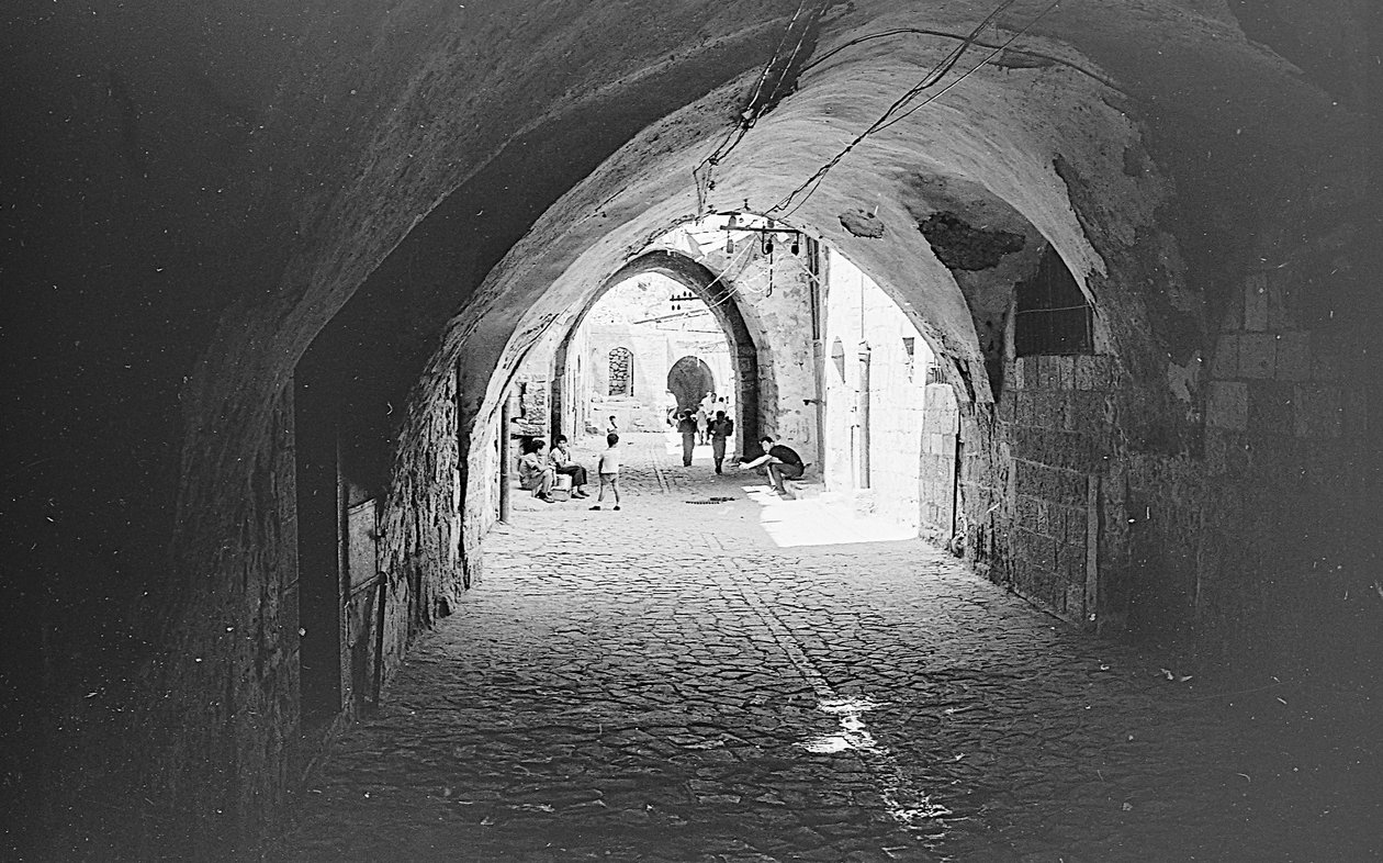 Road in the souks of the Old City of Jerusalem by Fosco Maraini