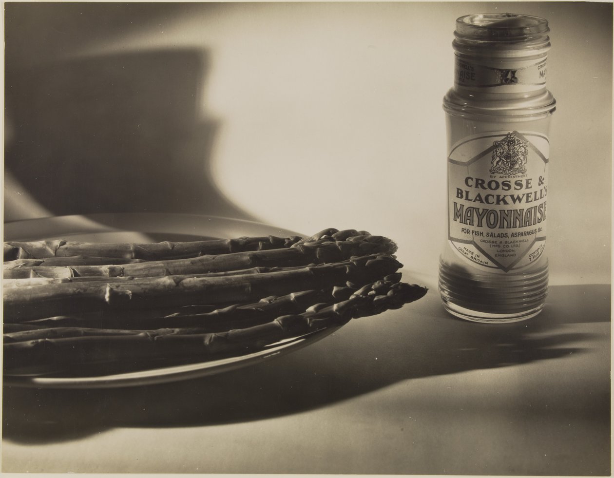 Still Life with Asparagus and Jar of Mayonnaise by Francis Bruguière