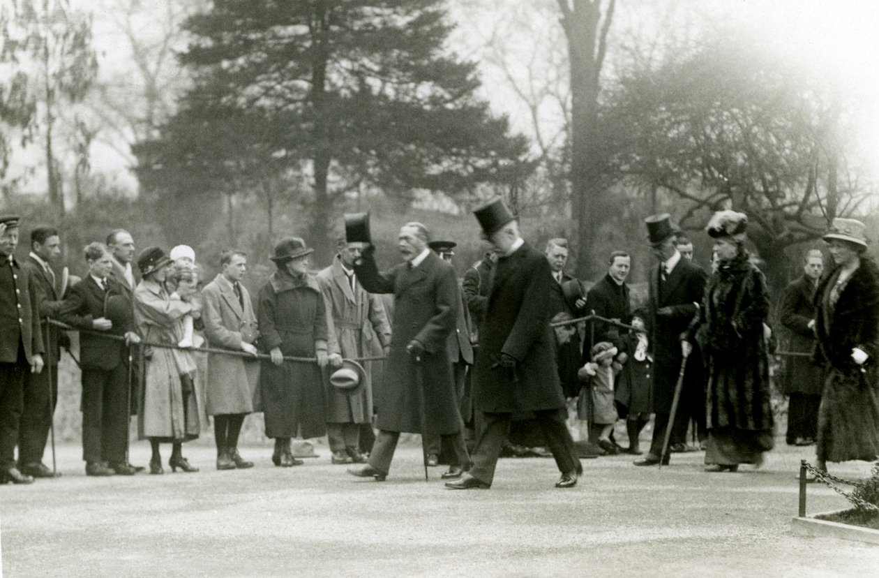 King George V raising his hat to the crowds at the front of his entourage, during a visit to London Zoo to officially open the Aquarium, April 1924 by Frederick William Bond