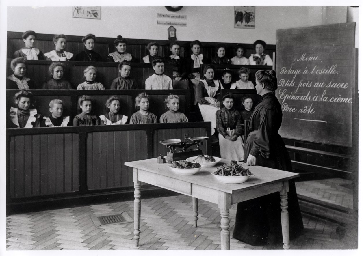 Young girls in a cookery lesson by French Photographer
