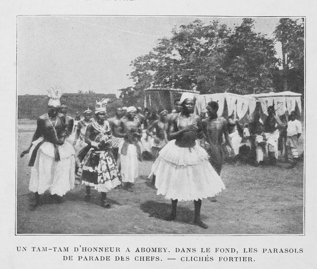 A Tam-Tam of Honour in Abomey with Parasols of the Chiefs in the Background by French Photographer