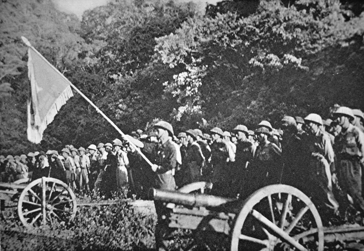 Communist Viet Minh troops on parade with light field artillery, during the siege of Dien Bien Phu, November 1953-May 1954 by French Photographer