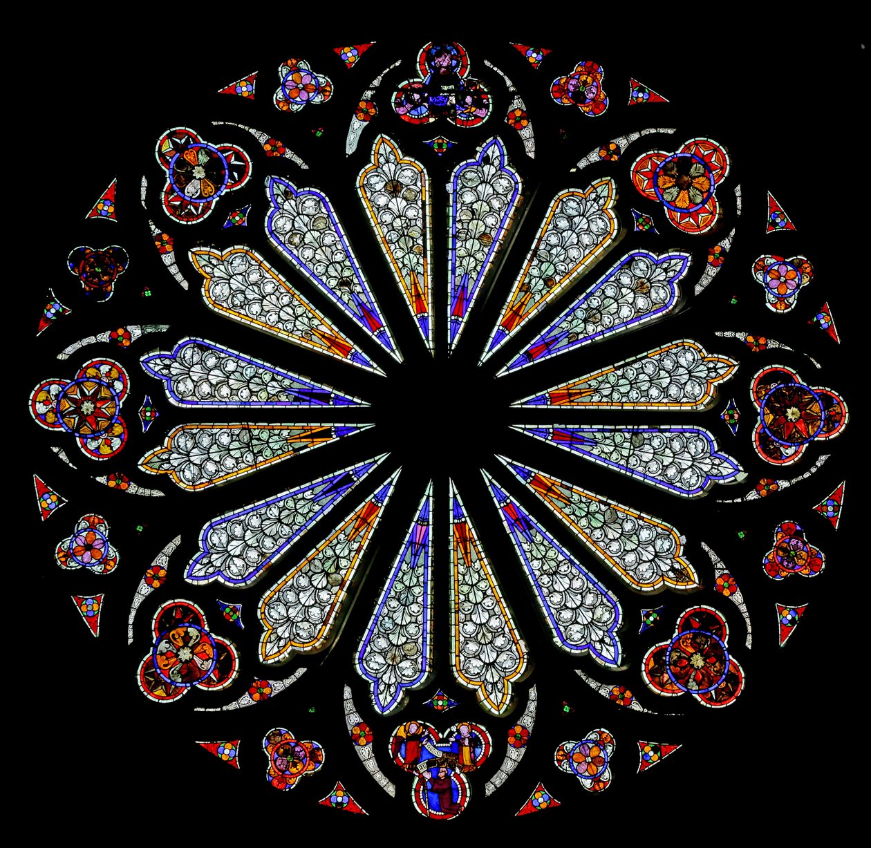 A late 13th century rose window with some original glass by French School