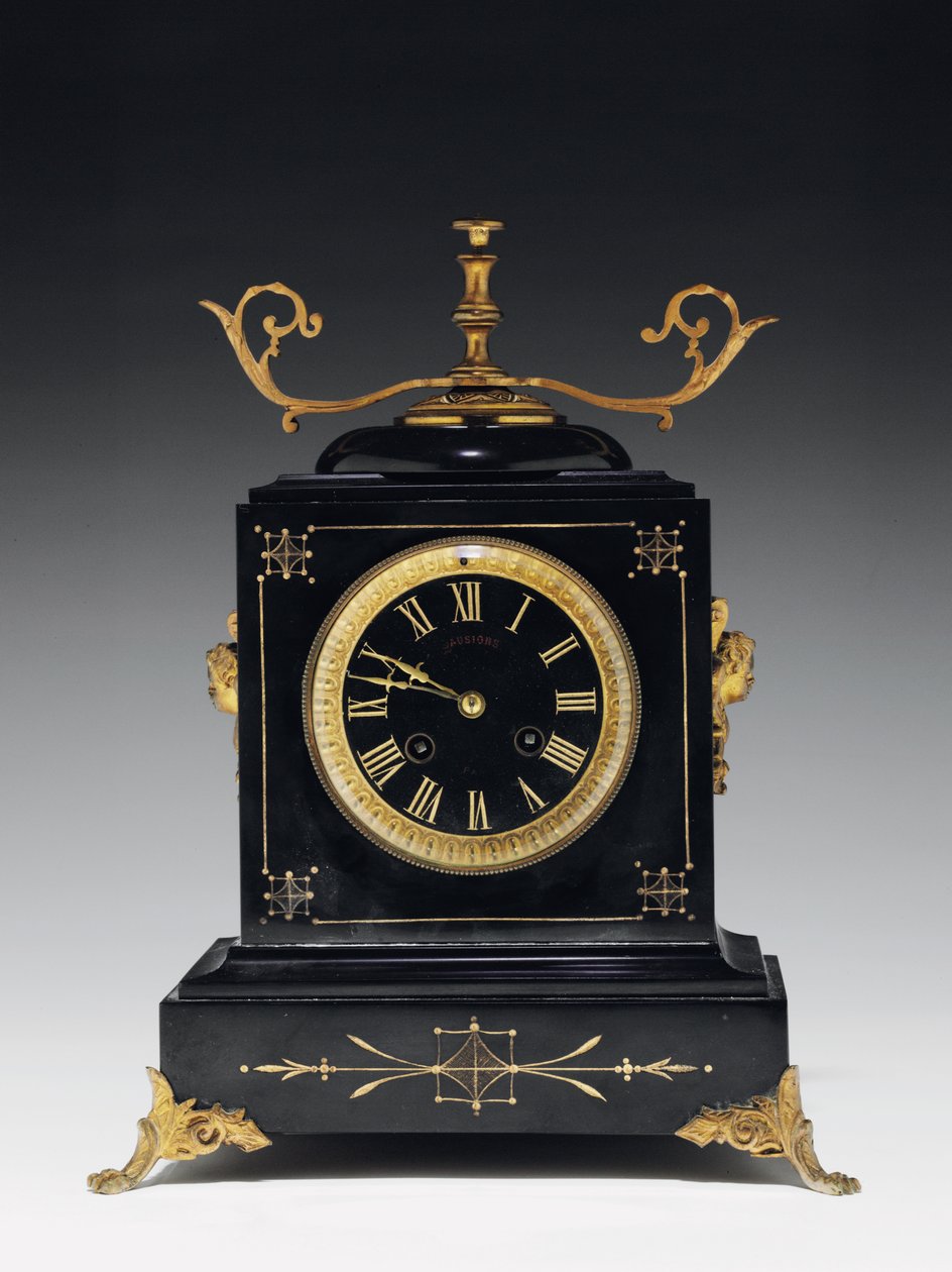 A Mantle Clock of Black Composition Stone, with Incised Decoration, with Legs, Finials and Fittings in Gilt Brass, by Jausions of Pau, France, c.1876-78 by French School