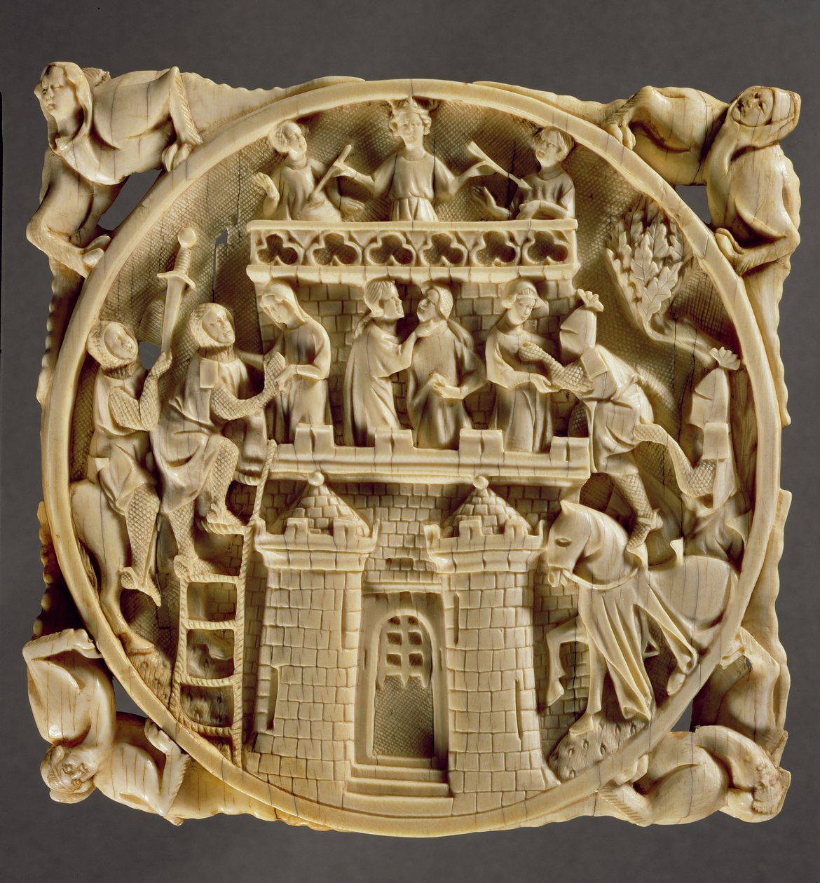 Ivory back of a mirror depicting the God of Love besieged in his castle by French School