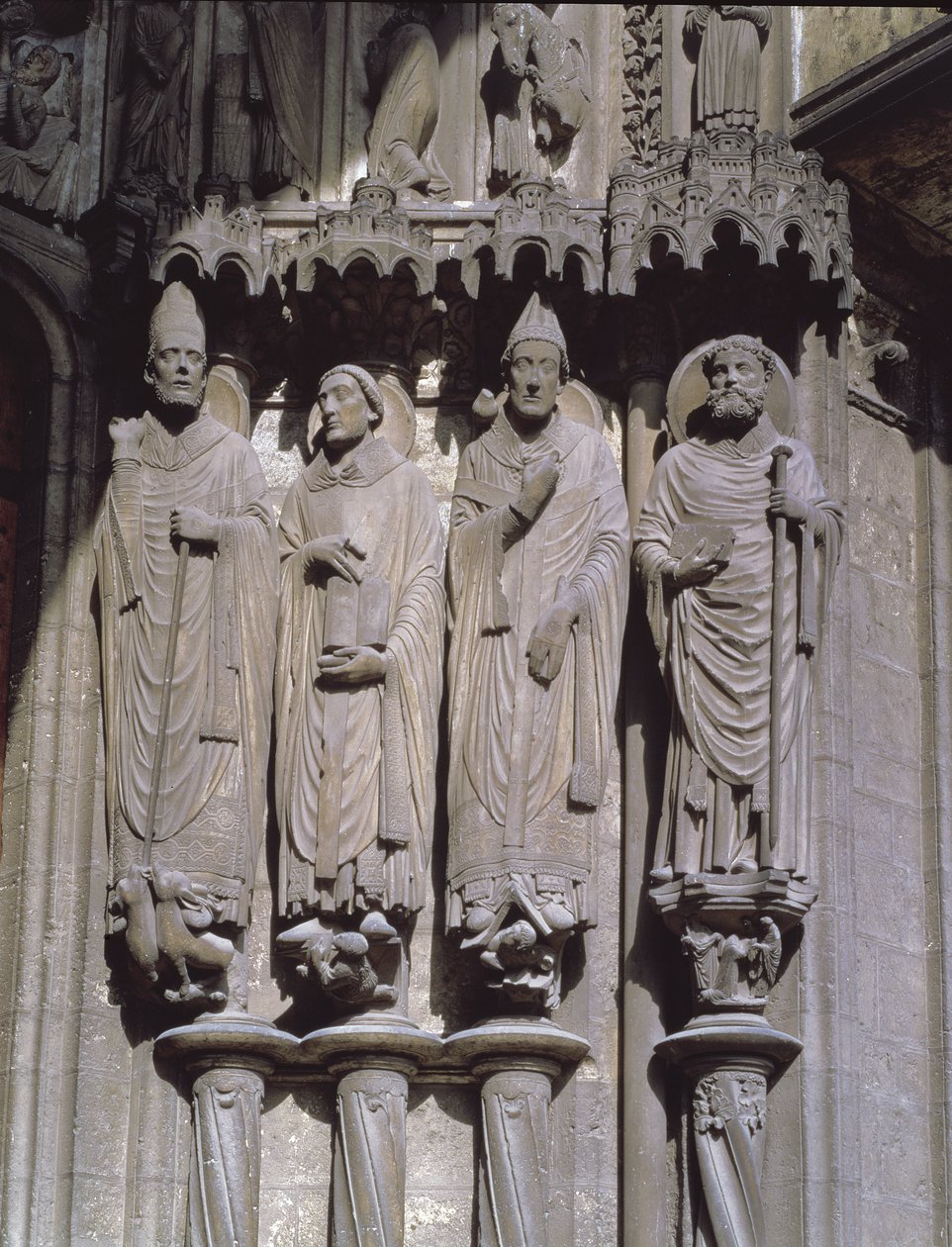 St. Martin, St. Jerome, St. Gregory and St. Avitus, jamb figures of the Confessors from the east portal of the south porch, early 13th century by French School