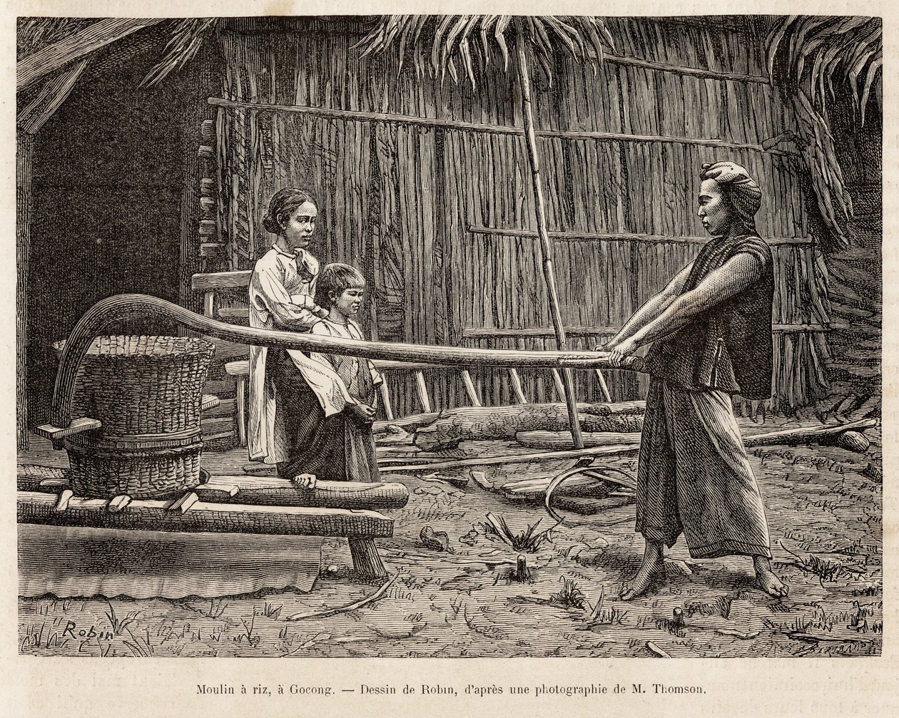 The rice mill, in front of a farmer
