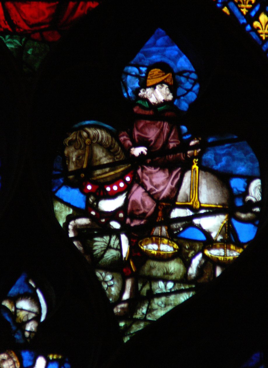 The west rose window depicting a scene from the Book of Revelation: A horseman carrying the scales to measure the wheat and barley by French School