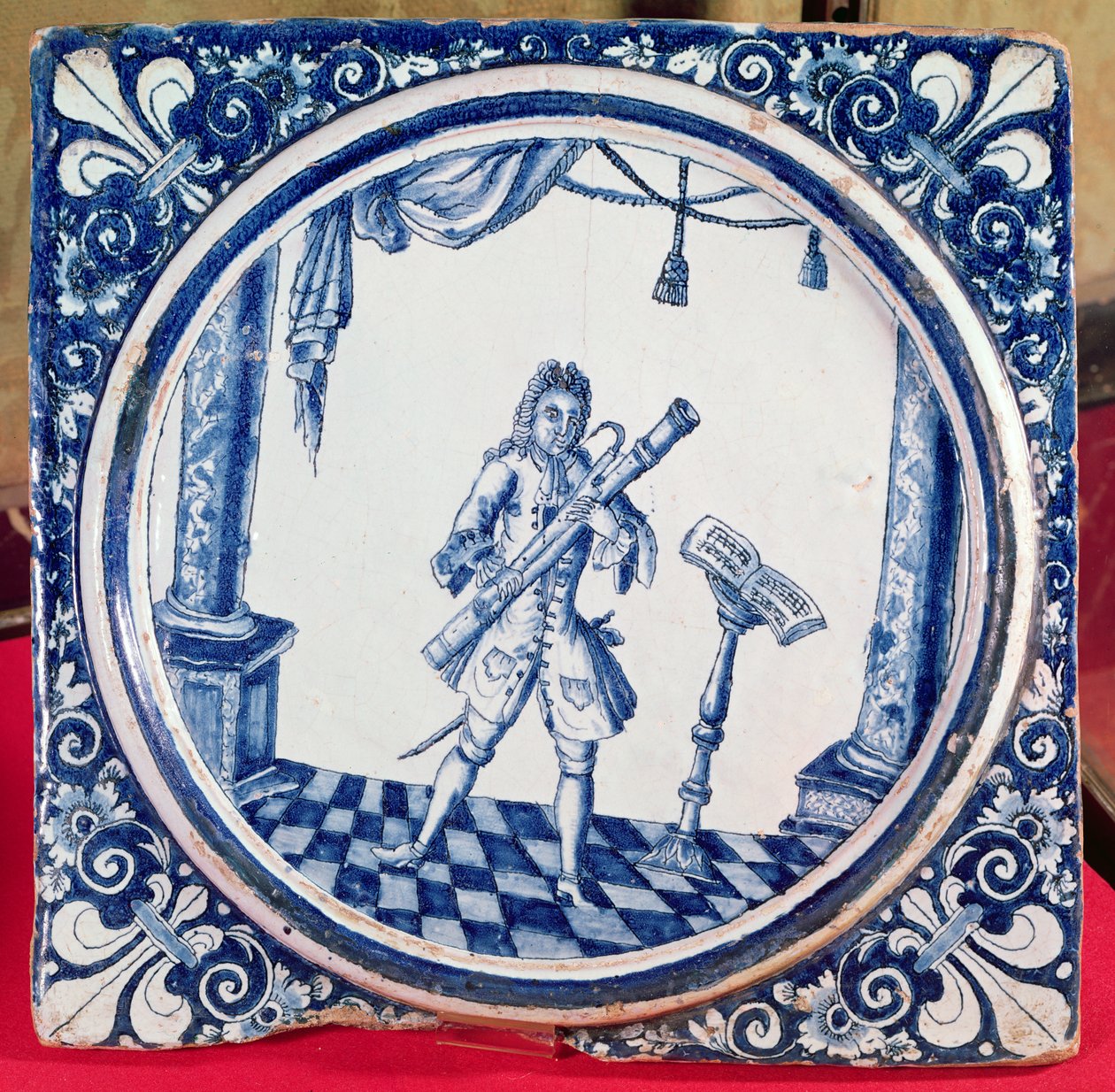 Tile depicting a bassoonist, 1706 by French School