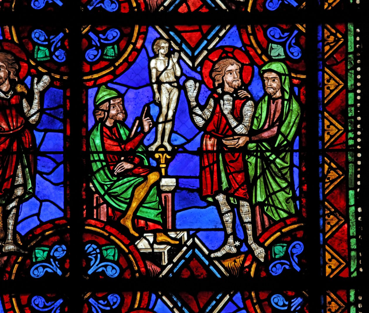 Window depicting St Julian of Brioude story - St Ferreol, a friend of Julien, who died during the Diocletian persecutions, forced to worship idols by French School