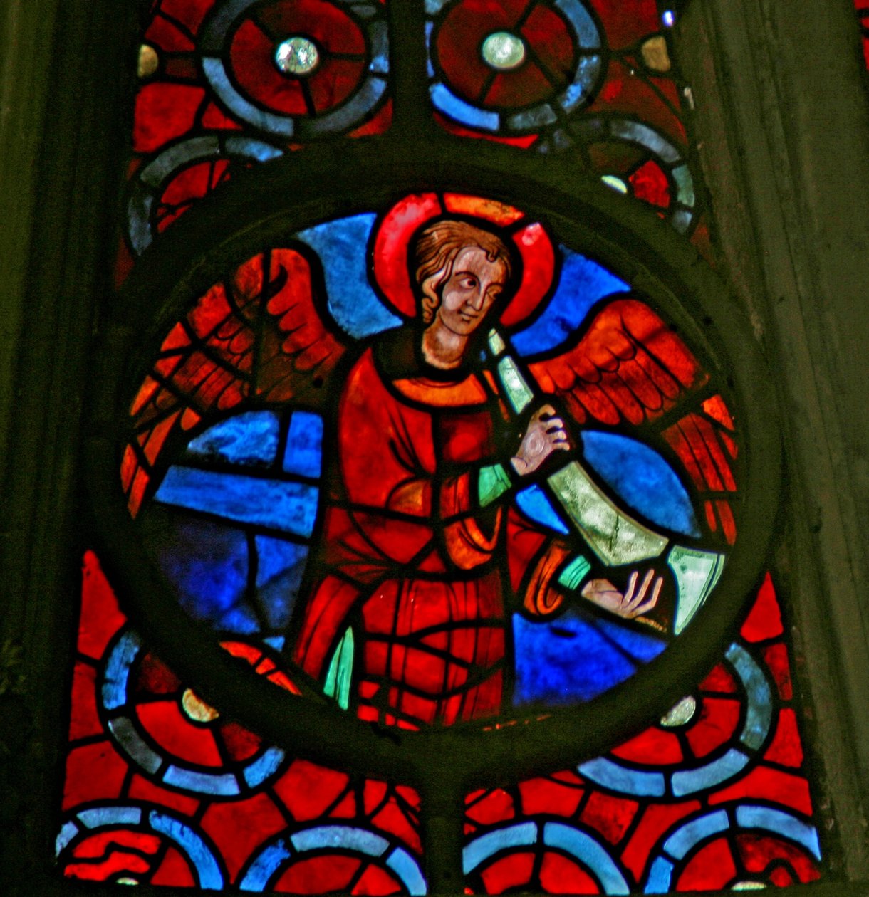 Window w141 depicting a musician angel with a shawm by French School