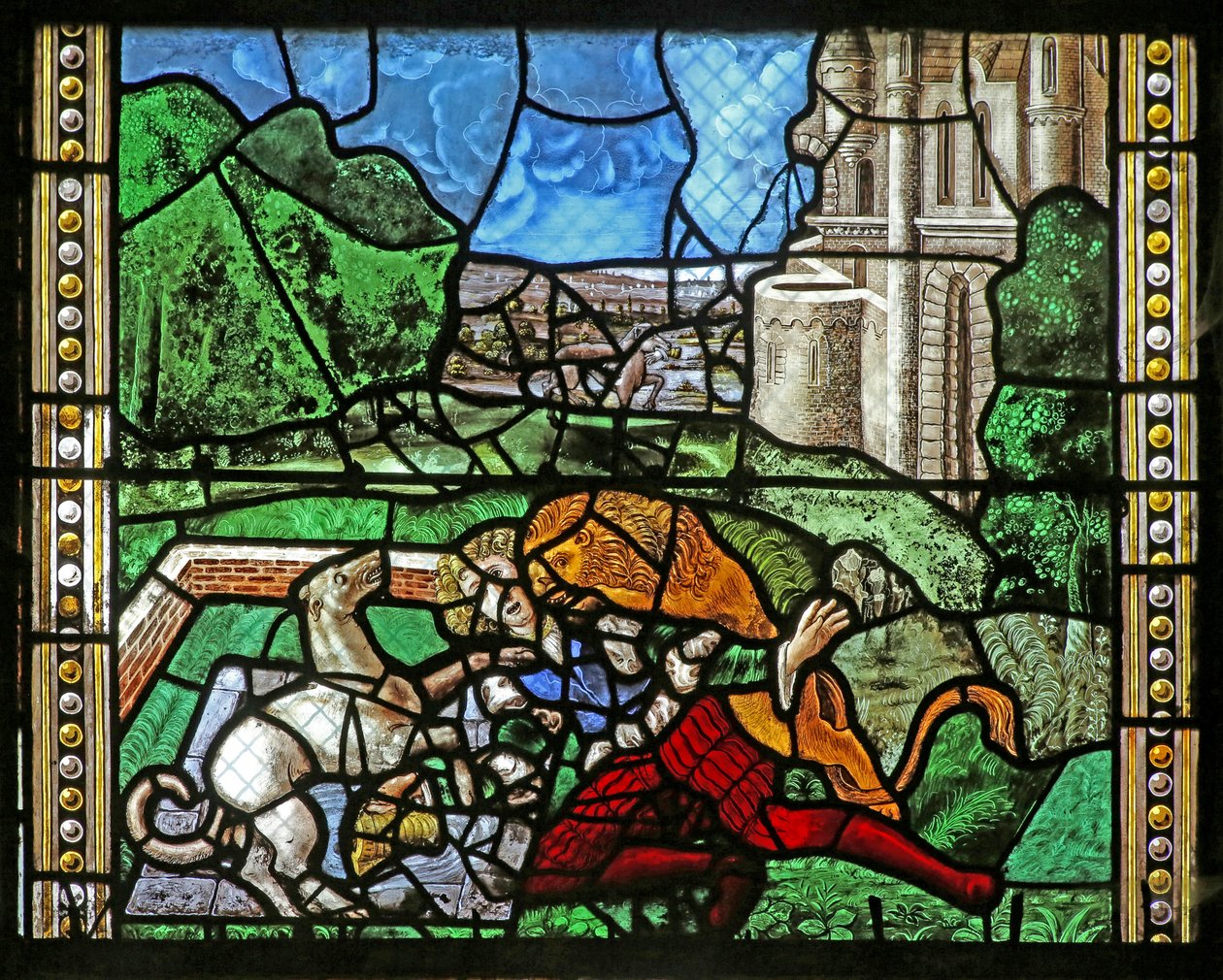 Window depicting St Thomas in India is invited to the wedding of Pelagius, is beaten by a servant who is in turn eaten by a lion. A dog brings in the servant