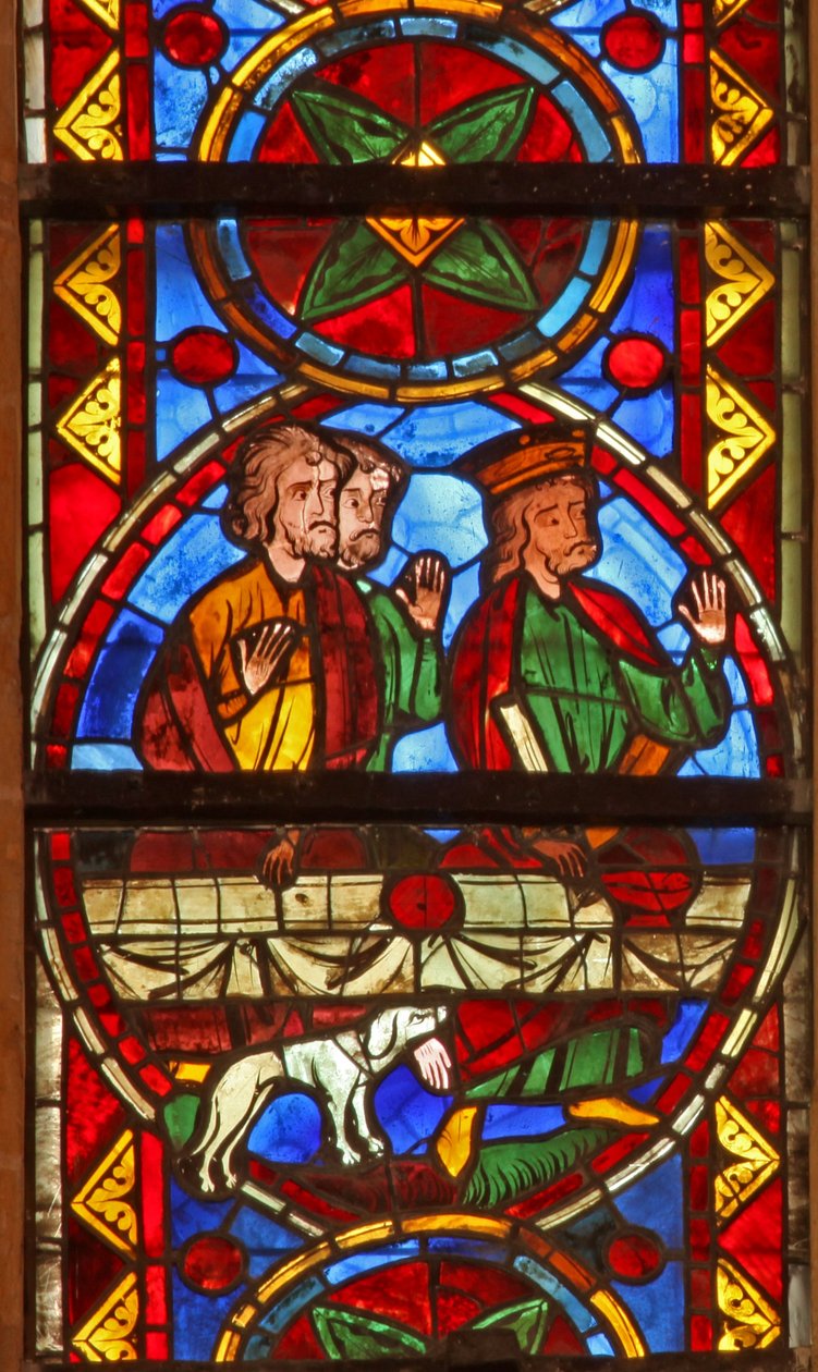Window w213 depicting a scene from the life of St Thomas: at the banquet a dog brings in the cupbearer