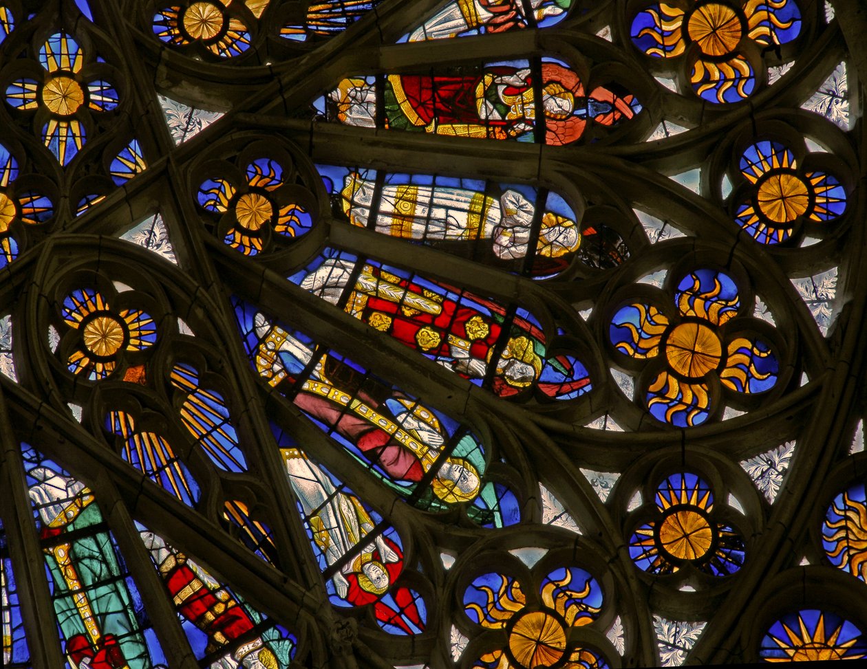 Window depicting suns and bishops beneath the Angelic Hierarchy in the north rose window by French School