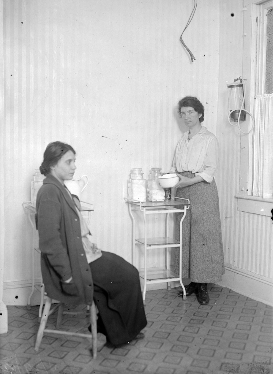 Margaret Sanger with her colleague Fania Mindell, at the clinic in Brownsville, Brooklyn, c.1916 by George Grantham Bain