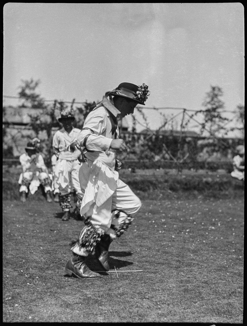 A member of the Bampton Morris troupe performing in a 