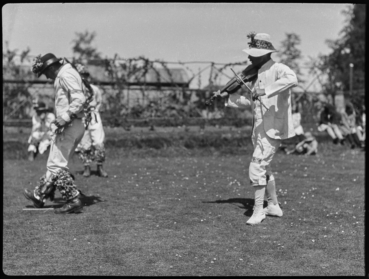 A member of the Bampton Morris troupe performing in a 