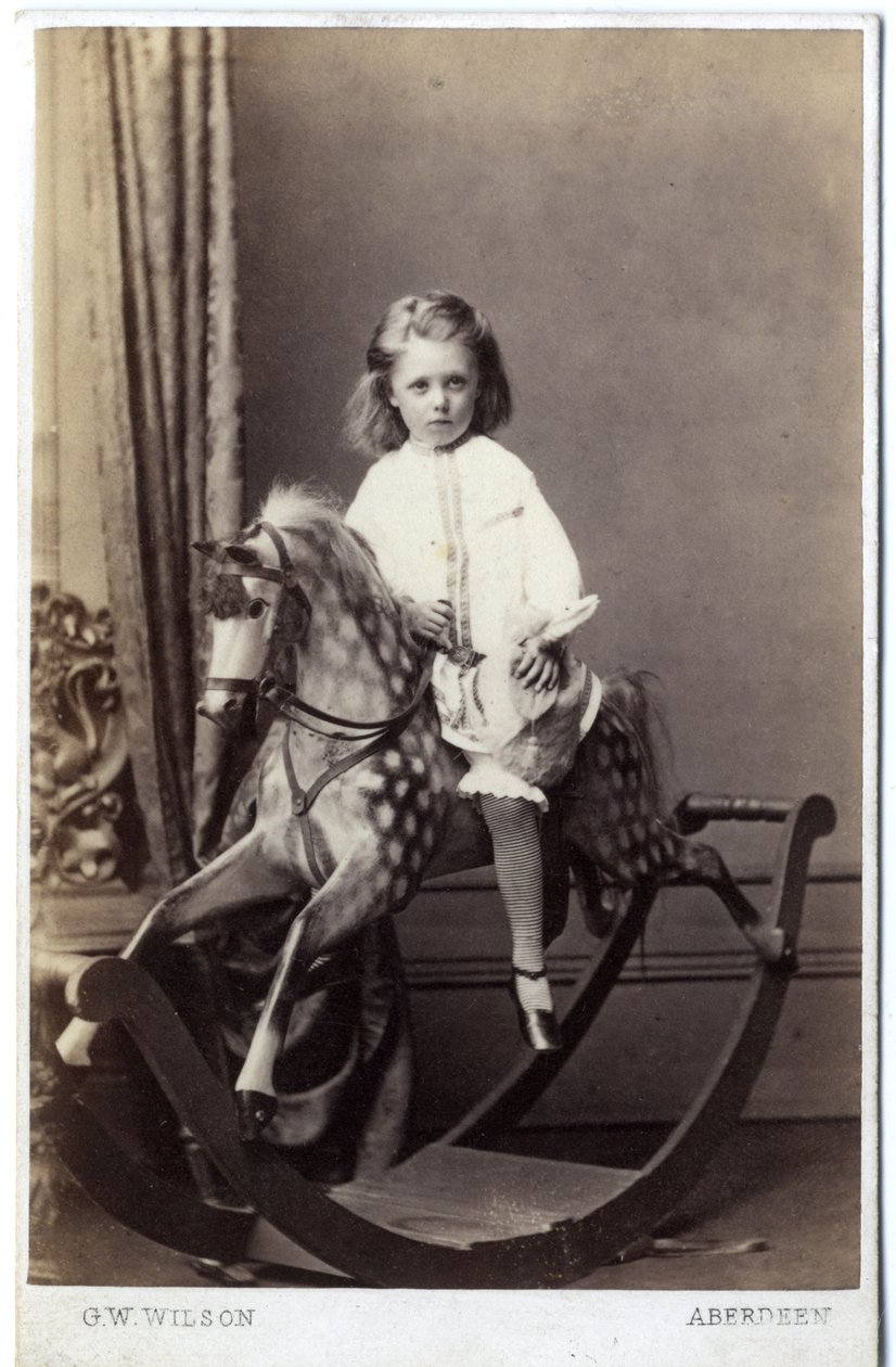 Young girl sitting on a rocking horse by George Washington Wilson