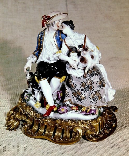 Meissen figures of a shepherd and shepherdess, mounted in Louis XV style ormolu scroll bases by German School