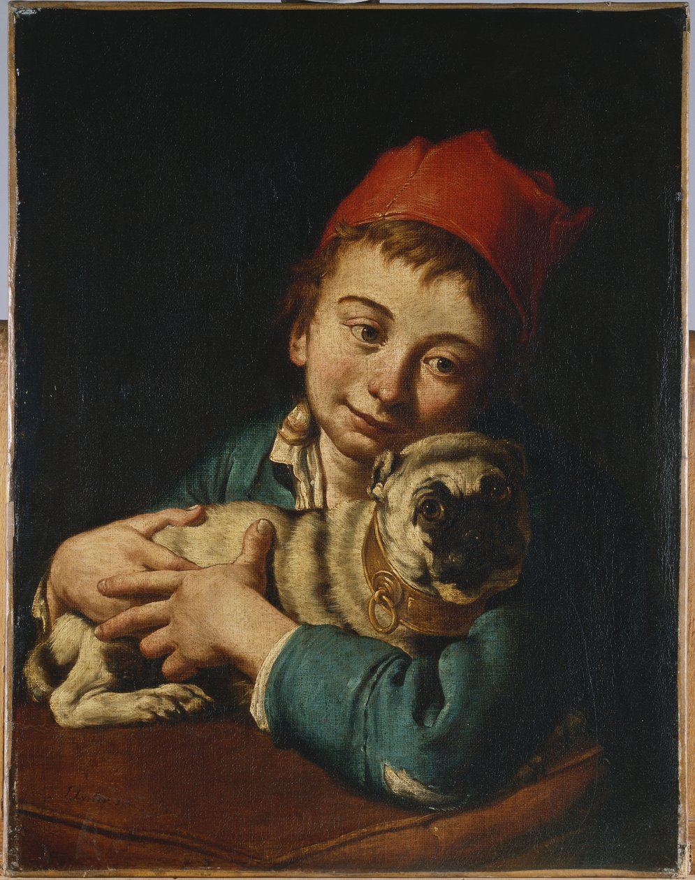 A Boy, Half Length, in a Blue Jacket and a Red Hat, Holding a Pug on a Cushion by Giacomo Ceruti