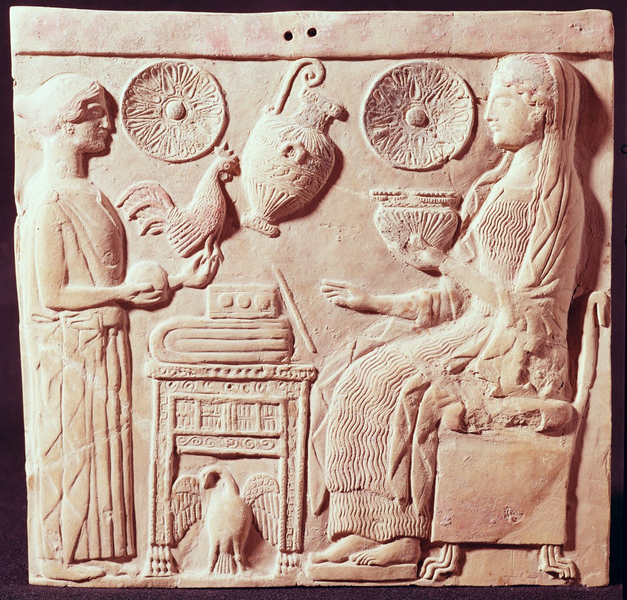 Plaque depicting a woman offering gifts to a seated woman, from Locres by Greek