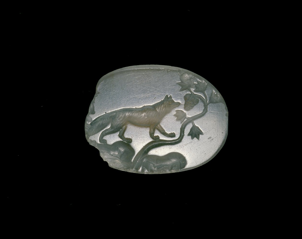 Sealstone depicting a fox with forelegs on a vine with grapes by Greek