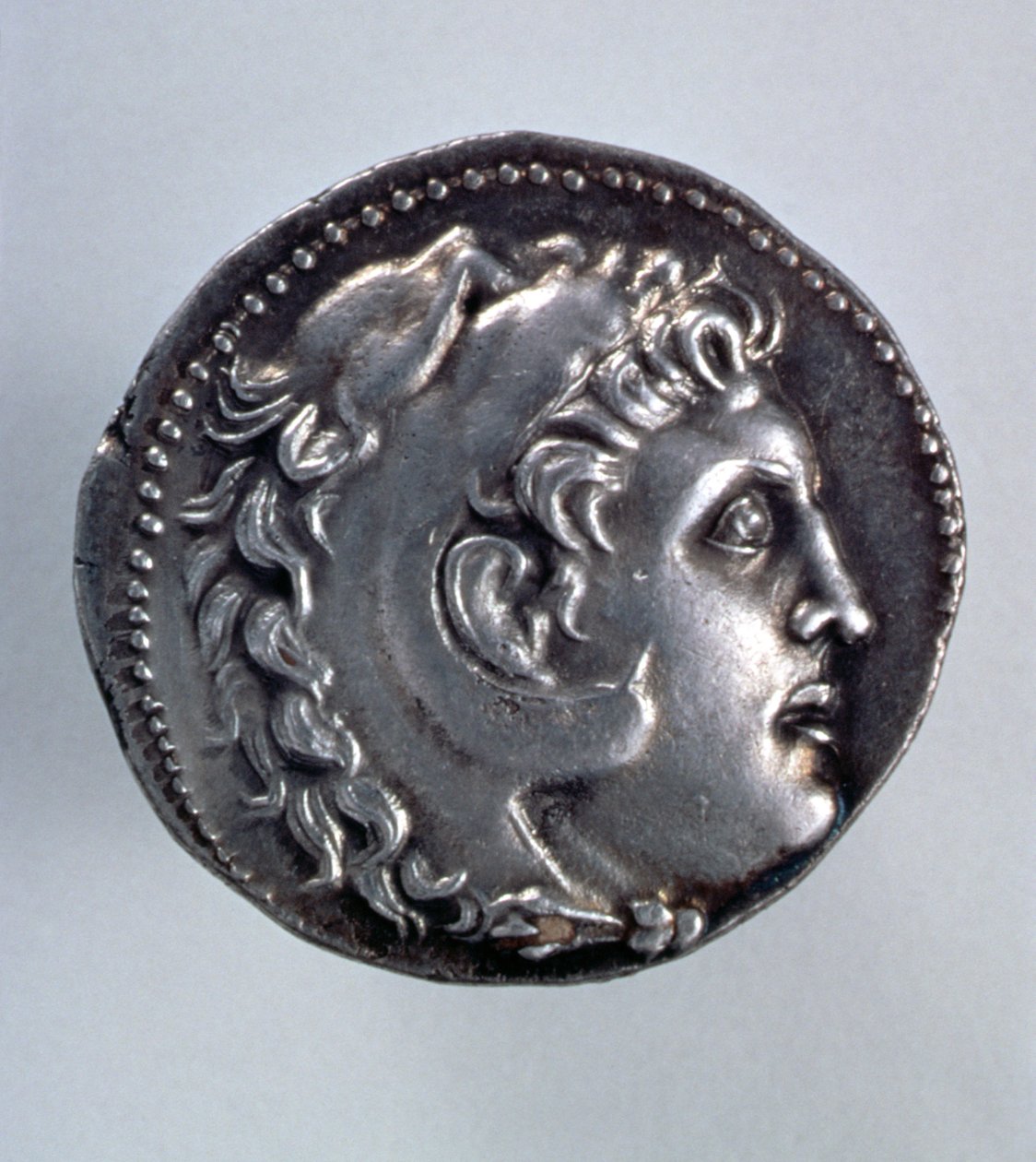 Alexander the Great Tetradrachm showing the head of Herakles wearing a lionskin headdress by Greek School