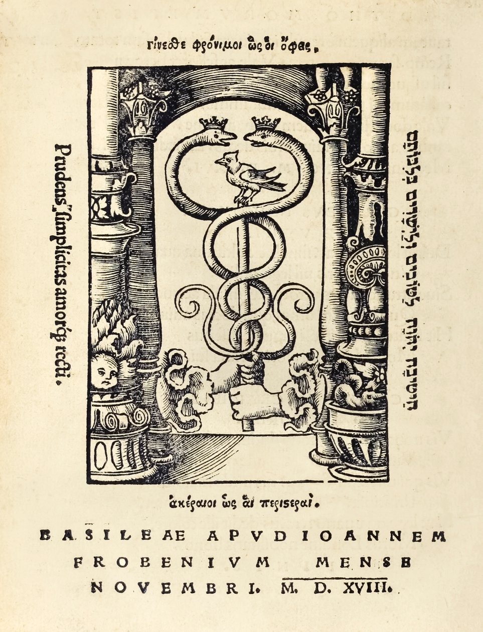 Printer's mark of Johann Frobens showing two hands holding the caduceus ...