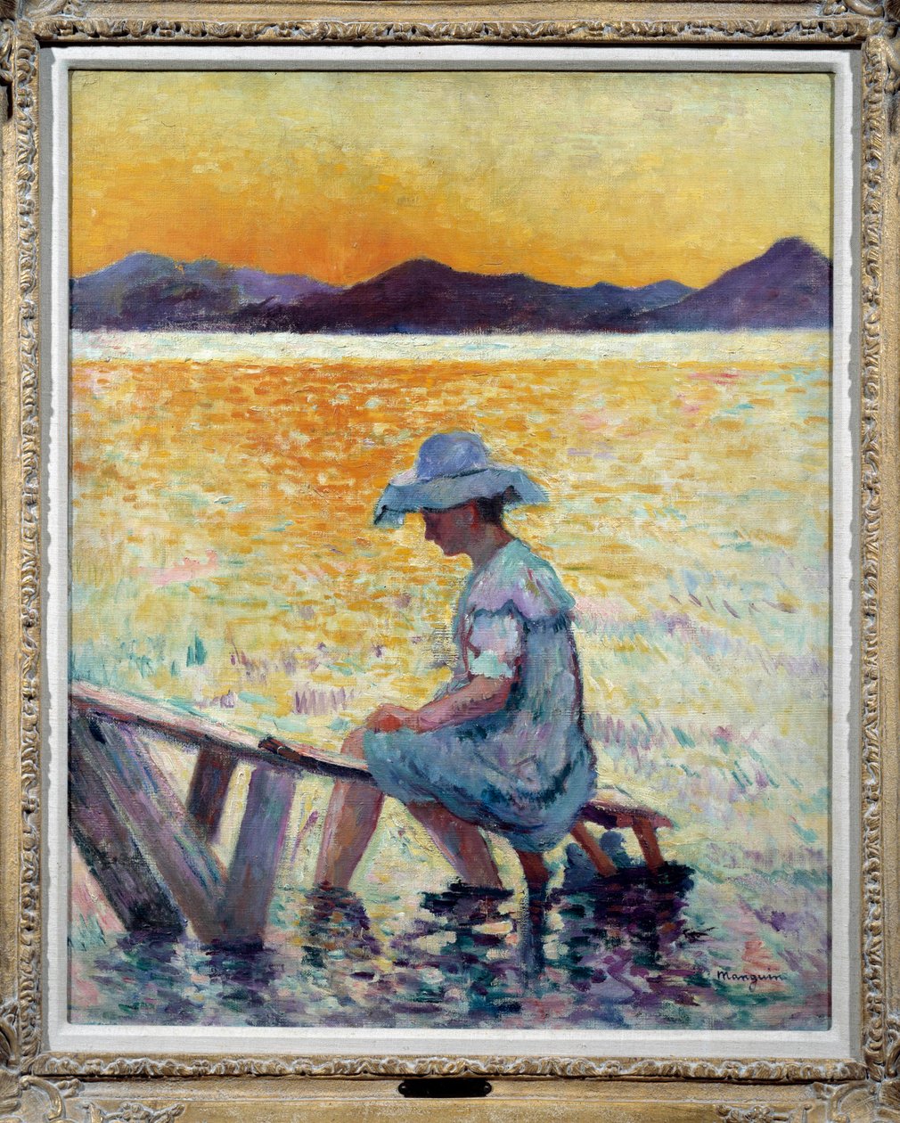 Saint Tropez, sunset A woman sitting her feet in the water on the shore by Henri Charles Manguin