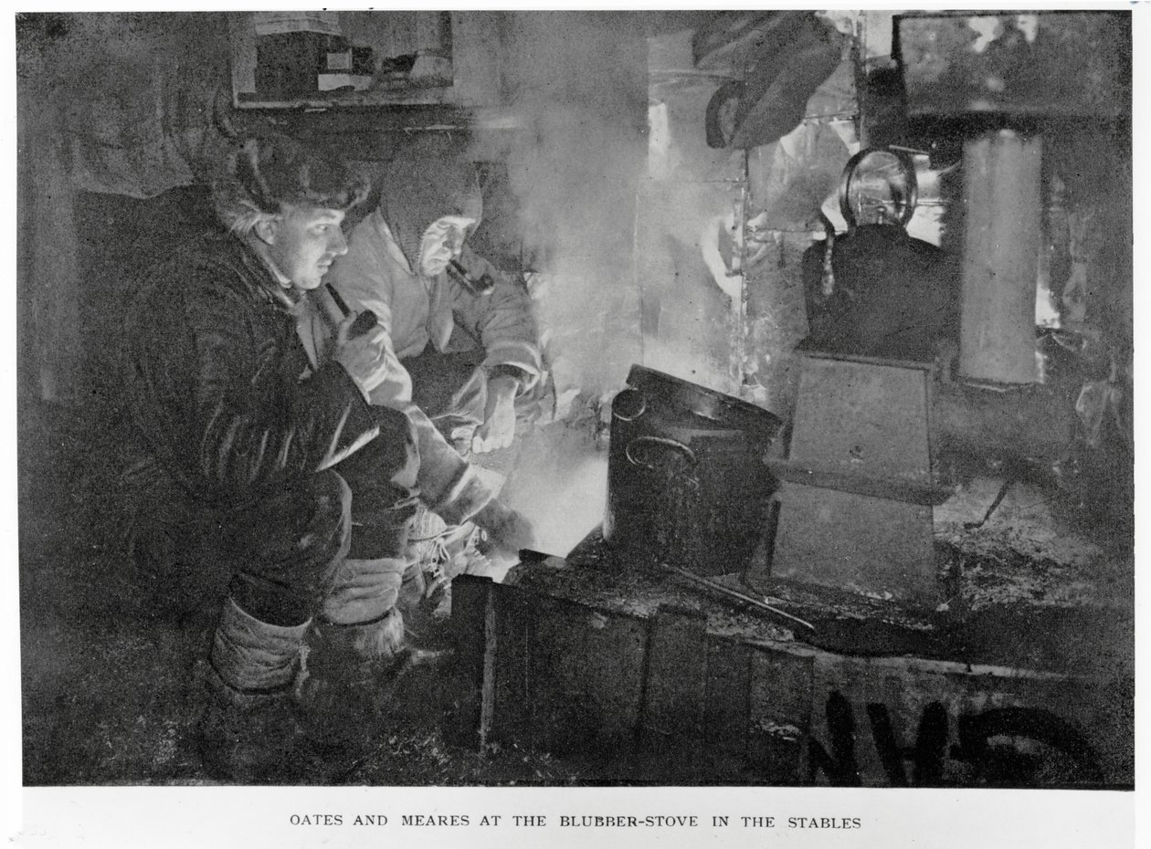 Oates & Meares at the Blubber Stove in the Stables by Herbert Ponting