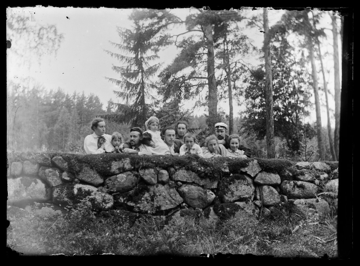 Hugo Simberg with Siblings on a Stone Wall by Hugo Simberg