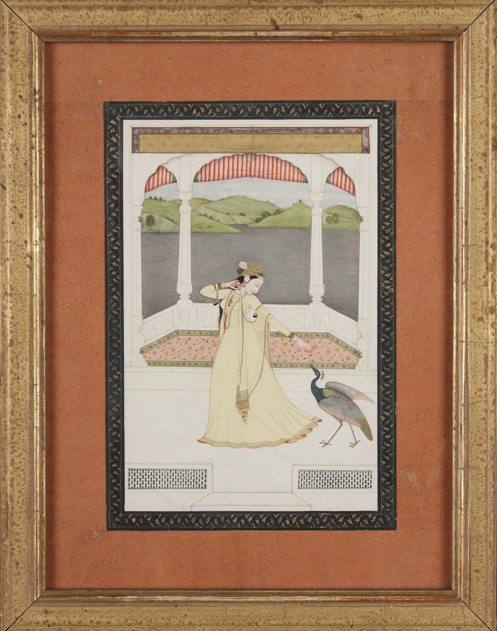 Lady enticing a peacock with a strand of pearls by Indian School