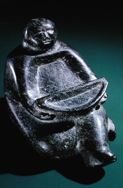 Figure holding offering bowl, from Cape Dorset by Inuit School