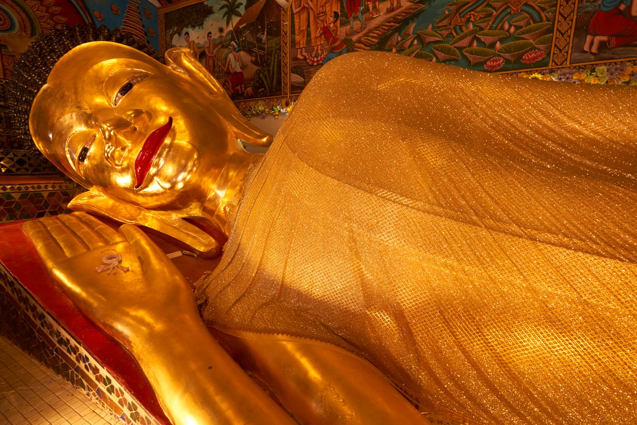 Reclining Buddha statue at Wat Phra Pan(Phra Non Mae Puka), Chiangmai, Thailand, 2019 by Ira Block