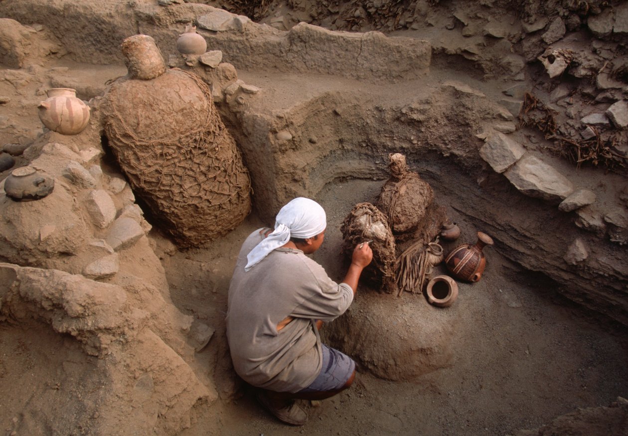 Richard Gomez cleaning newly discovered artifacts at the school dig site by Ira Block