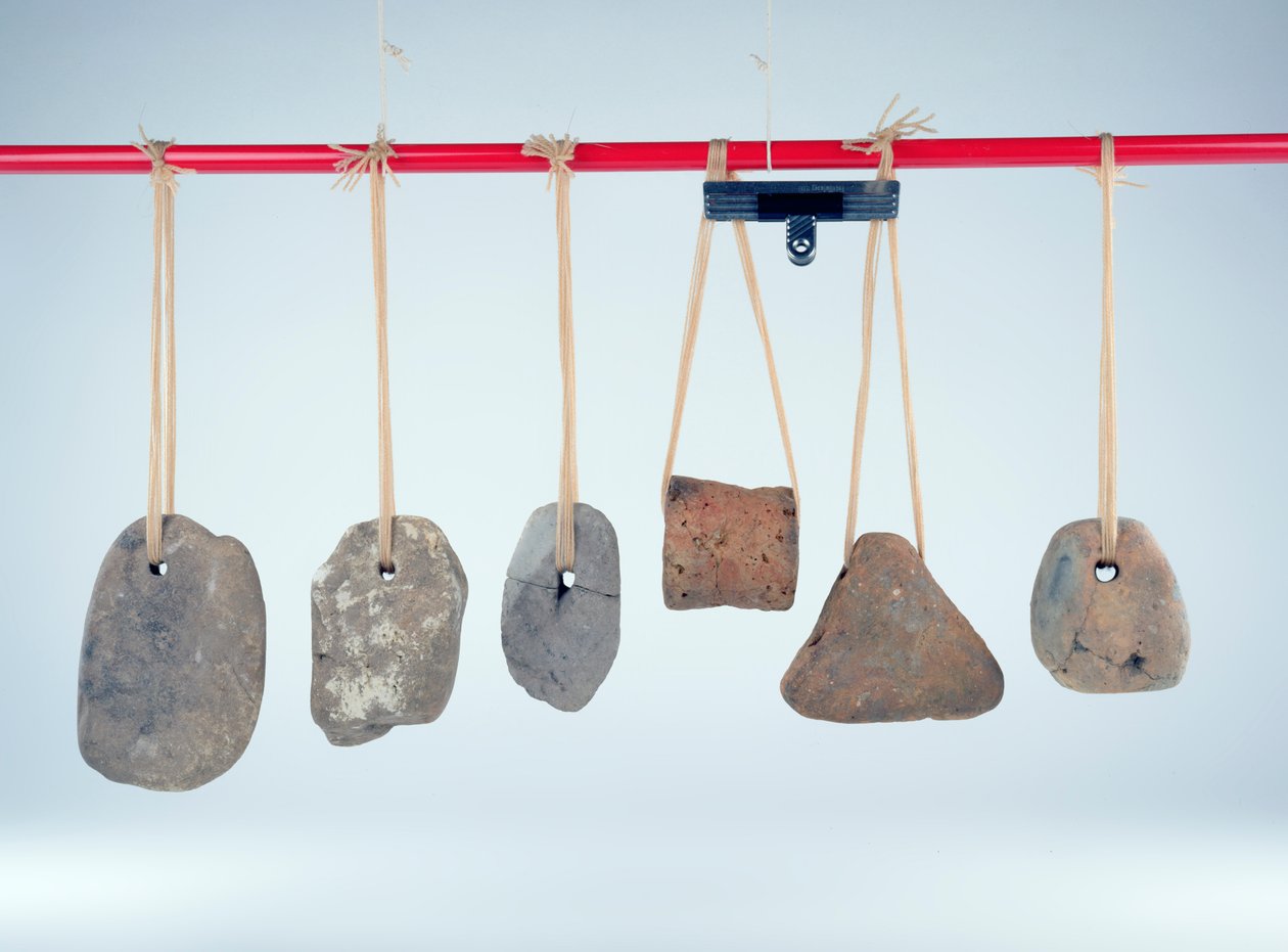 Weights used to keep vertical warp threads taut on upright looms, Iron Age by Iron Age