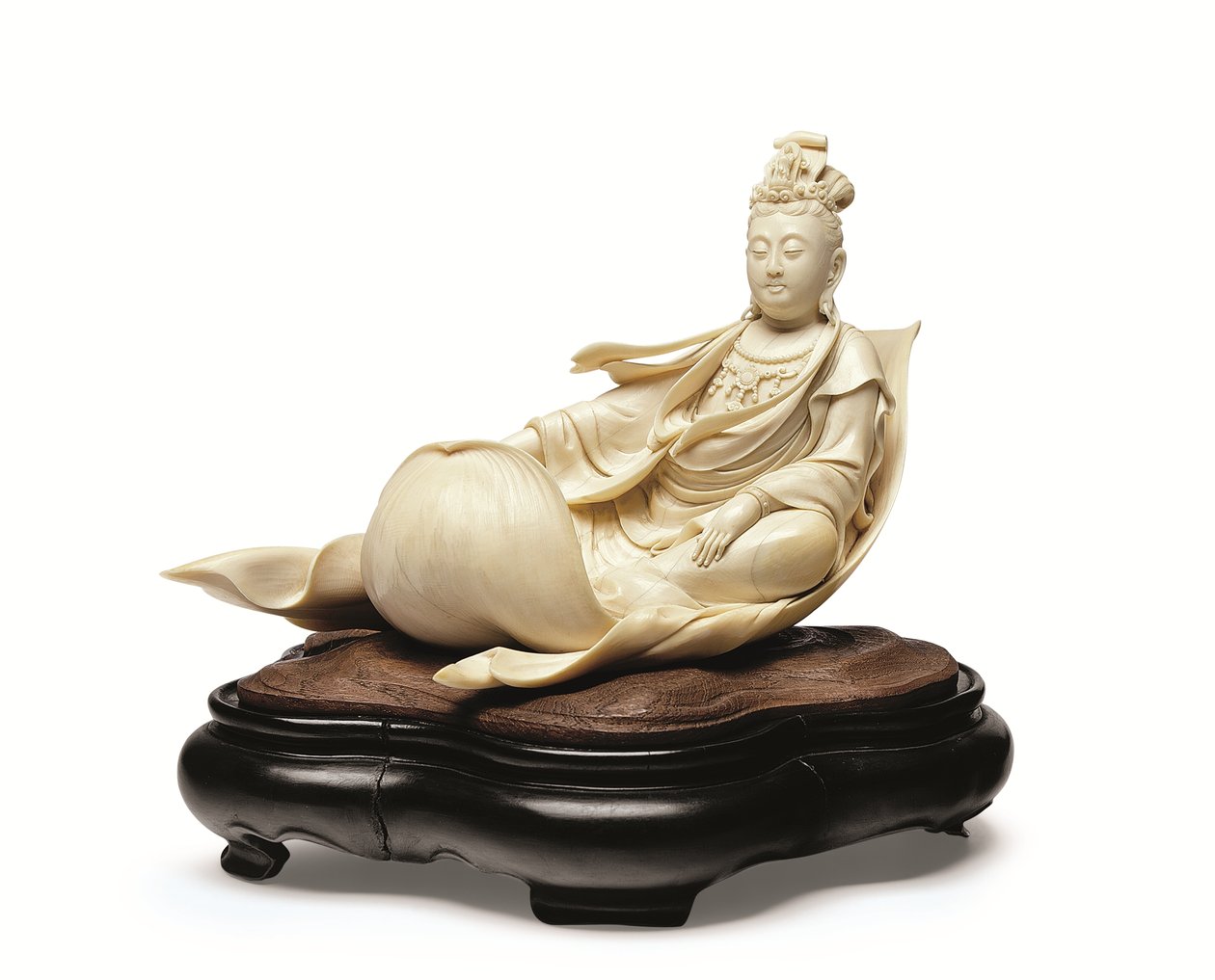 An ivory carving of Kannon floating on a lotus leaf, Meiji period, late 19th century by Ishikawa Komei