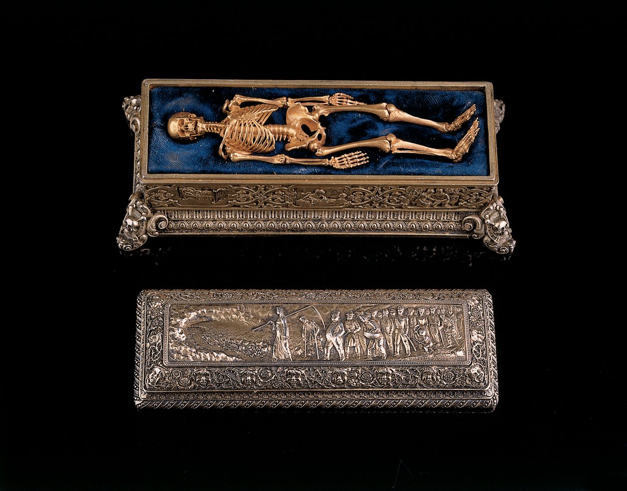 Miniature human skeleton and sarcophagus