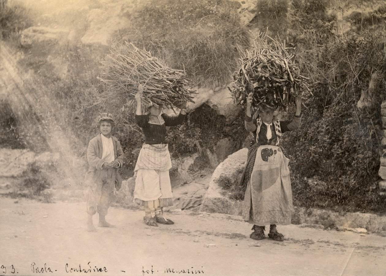 Farmers Carrying Bundles of Wood on Their Heads, Paola, Calabria, Photograph by Leopoldo Menarini, ca 1910 by Italian Photographer