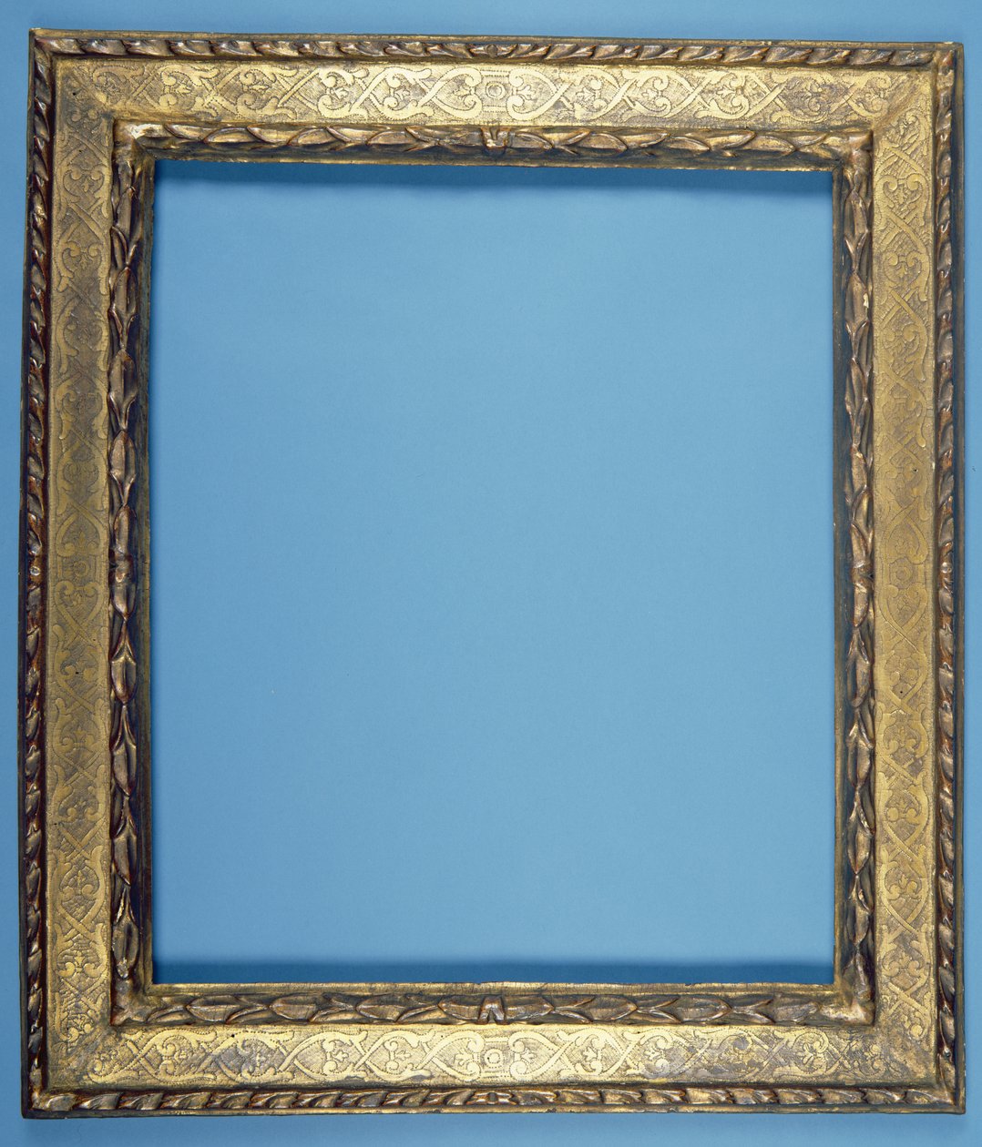 Carved and gilded plate frame with a stepped floral design by Italian School