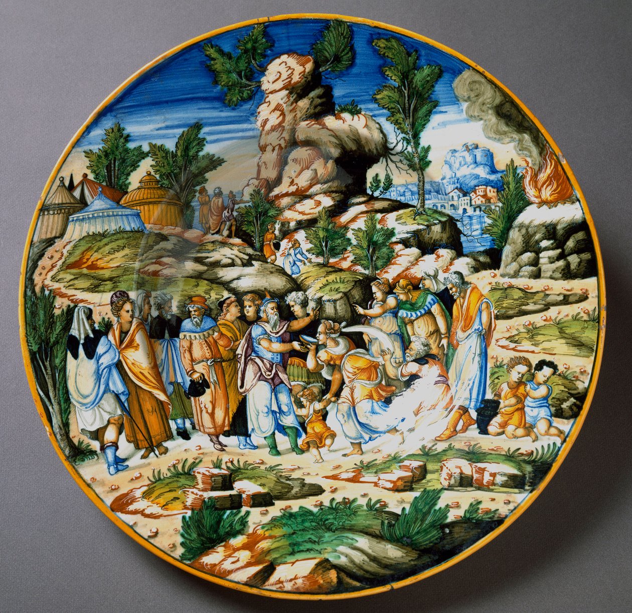 Moses Raises Water from the Rock and Gives a Drink to the People of Israel. Ceramic Plate Produced in Urbino by Italian School