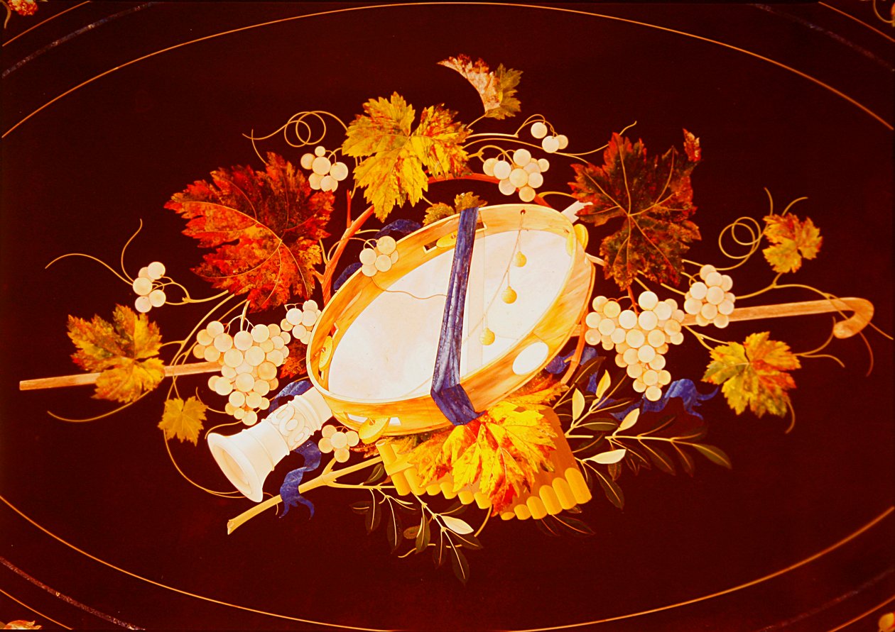 Table top with musical instruments and vines by Italian School