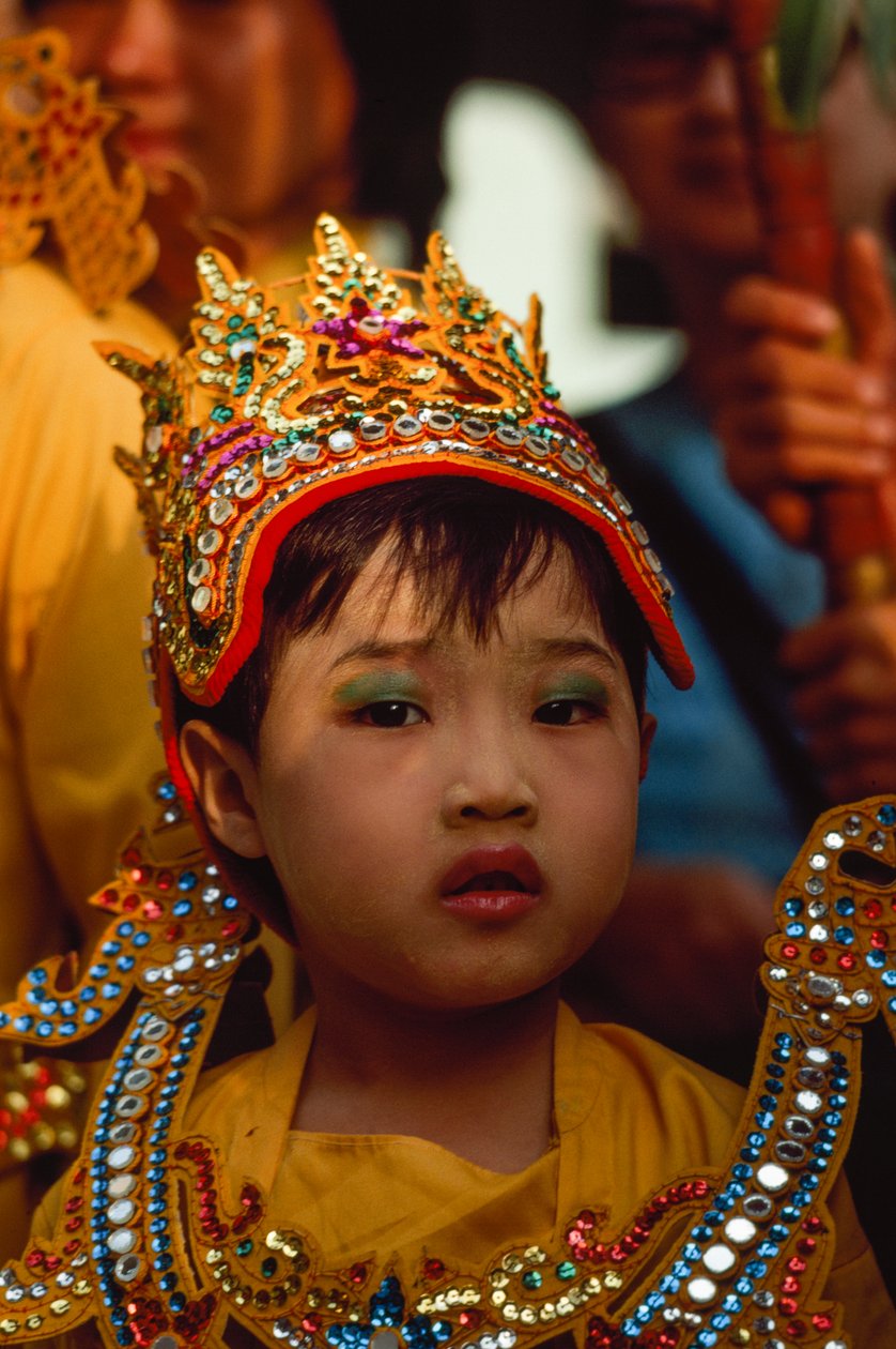 A Young Worshipper at the Tabaung Festival, Shwe Dagon Pagoda, Rangoon, Burma by James L Stanfield