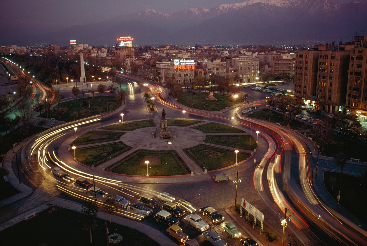 Car, city lights illuminate Plaza Baquedano, Santiago, Chile by James L Stanfield