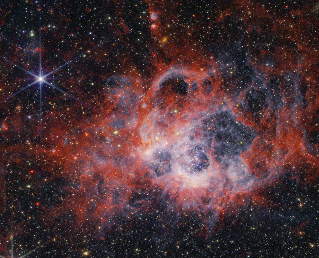 Peering Into the Tendrils of NGC 604 with NASA