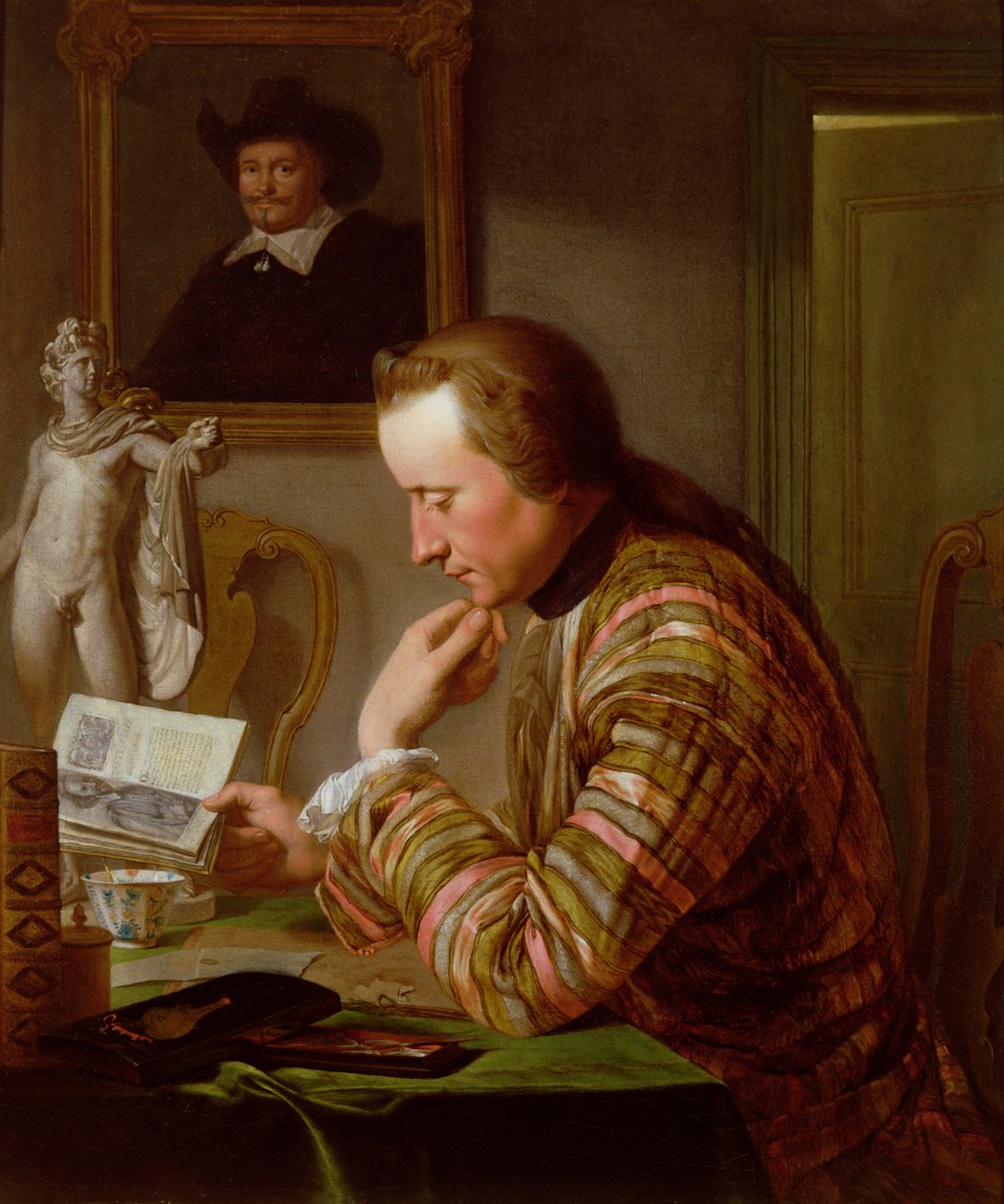 Gentleman Reading at a Table by Candlelight by Jan Maurits Quinckhardt
