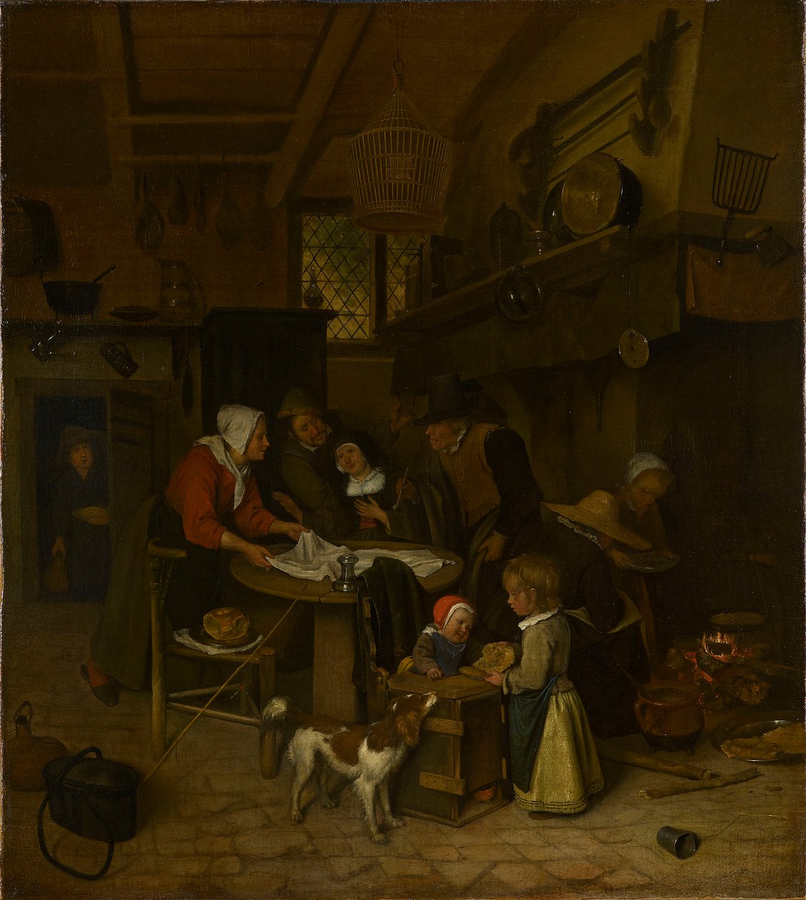 A Scene in a Peasant Kitchen with a Servant Laying the Cloth by Jan Steen